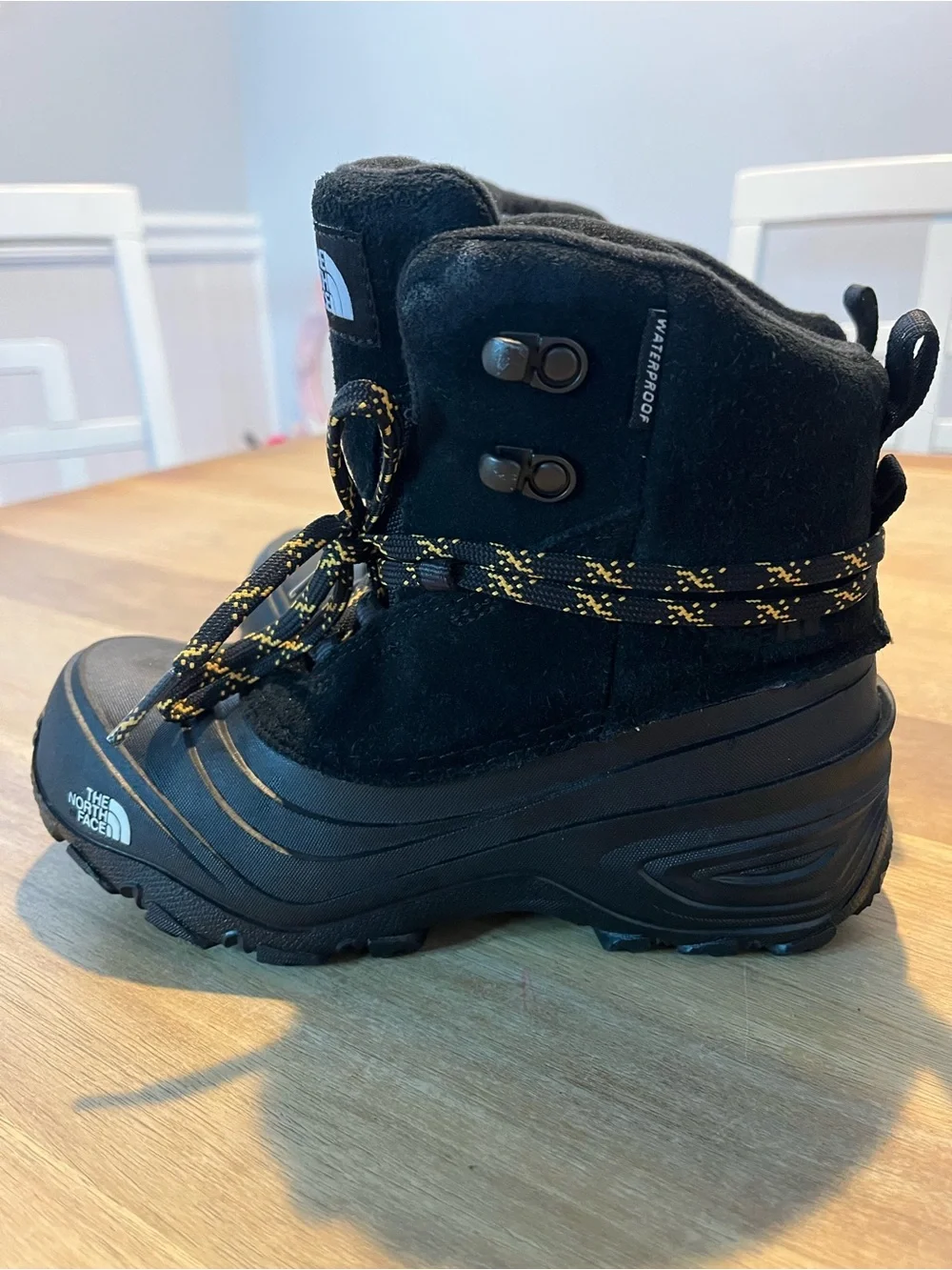The North Face Black Boots with Yellow-Accent Laces